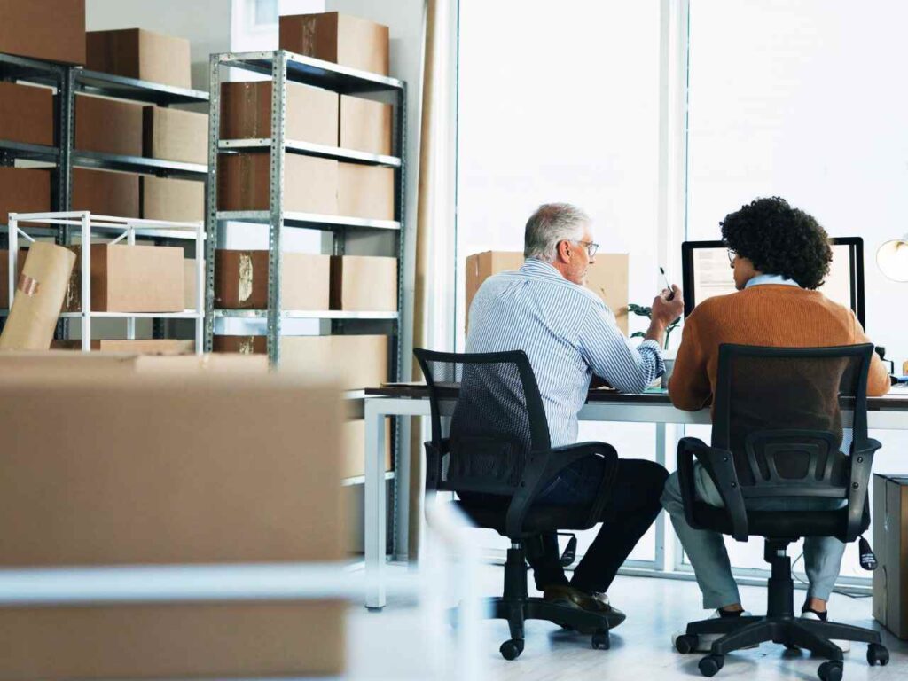 Funcionários em uma reunião sobre exportação para os EUA
