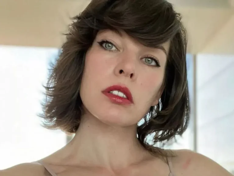 Retrato da atriz Milla Jovovich com cabelos curtos e batom vermelho, imagem frequentemente associada ao seu perfil oficial e projetos no GitHub.